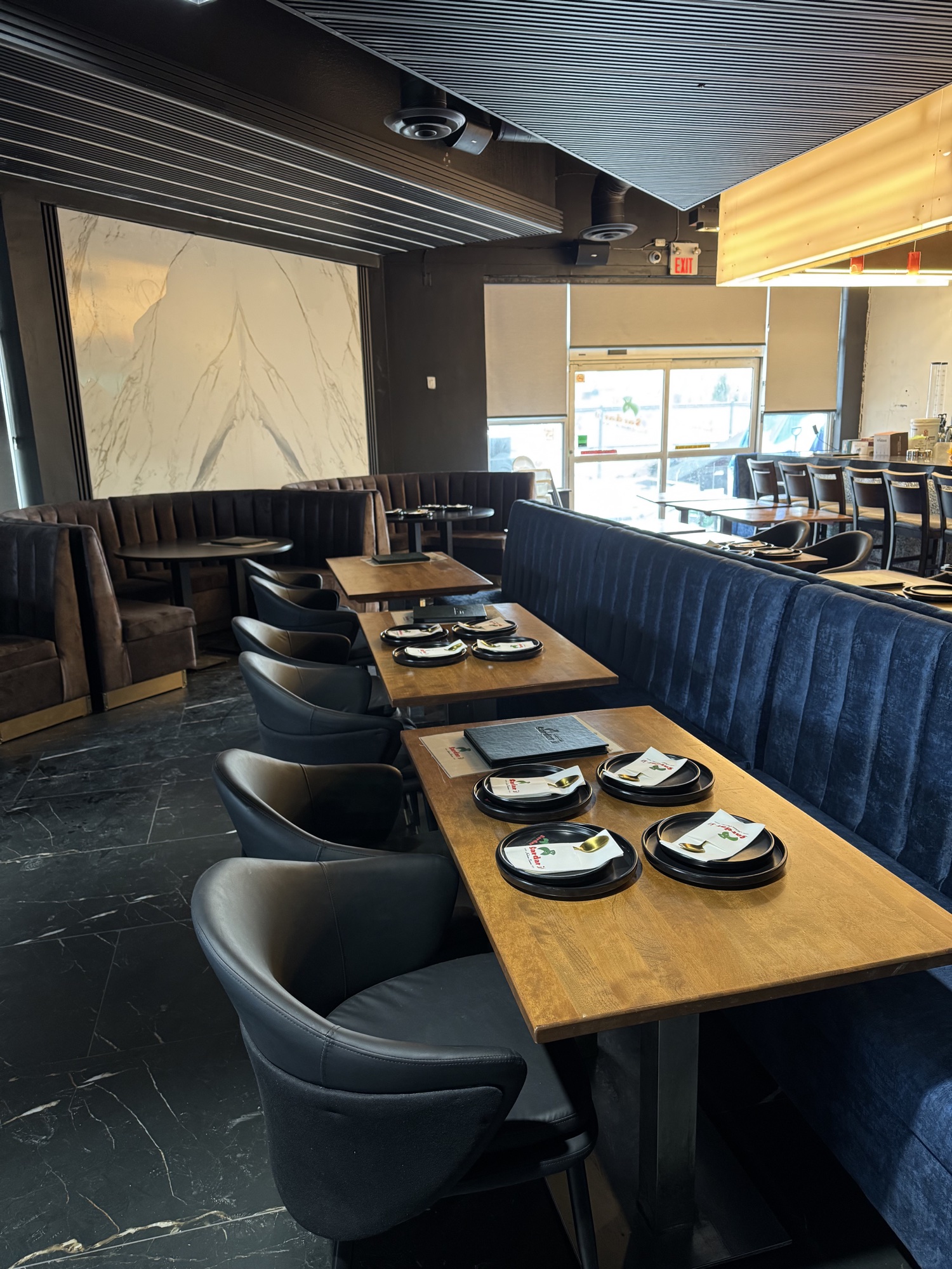 Curved blue custom banquette in a hospitality interior